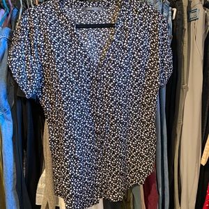 Never worn, size small, in good condition, black and white, short sleeve.